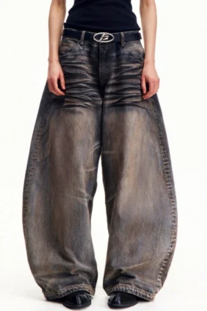 Straight front view of faded charcoal brown wide-leg jeans featuring a relaxed vintage streetwear silhouette