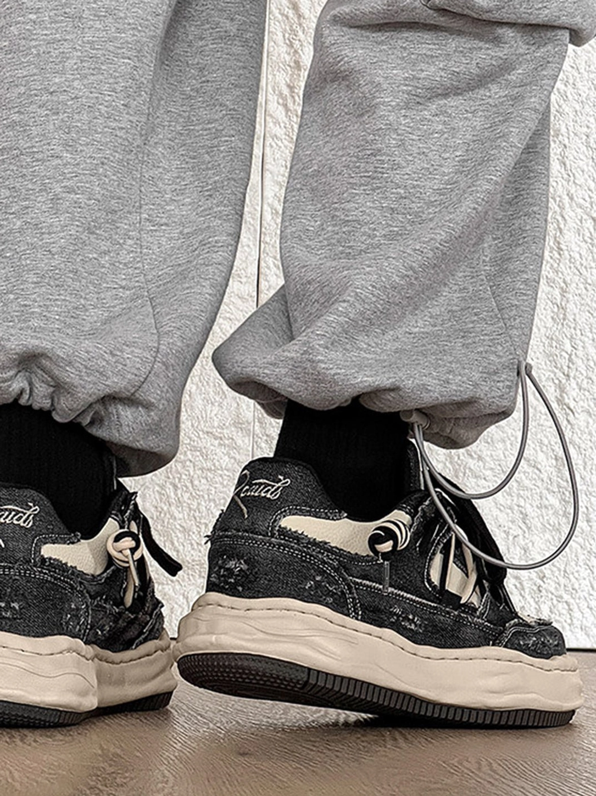 Retro washed denim streetwear sneakers showcasing chunky platform construction and versatile two-tone styling