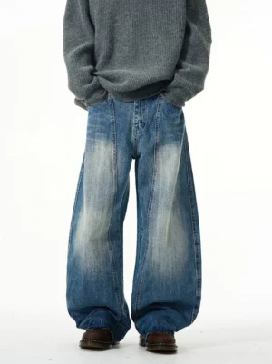 Front view of faded blue retro wide-leg jeans on a male model showing the relaxed oversized Korean streetwear fit