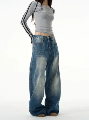 Full front view of retro washed wide-leg jeans styled with a slim grey long-sleeve top in a Korean streetwear outfit