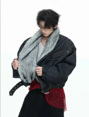 Three-quarter front view of reversible denim faux fur bomber jacket opened to reveal soft grey faux fur lining with cropped elasticated hem