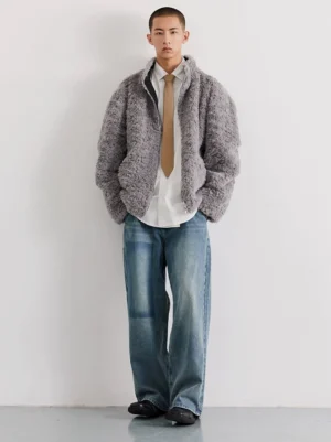 Grey faux sherpa reversible bomber jacket full front view styled with shirt tie and wide-leg jeans