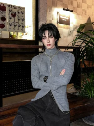 Heather grey ribbed full-zip stand collar sculpted shoulder streetwear top styled with black wide-leg pants in a retro cafe