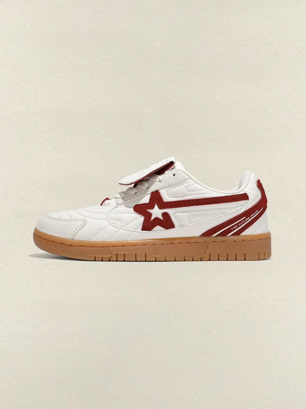 Rice red star panel retro court sneakers side profile on beige background showing wine-red star panels and gum sole