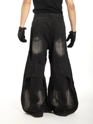 Riftcore distressed black wide leg super flare jeans rear view showing back pockets faded denim and frayed lower panels