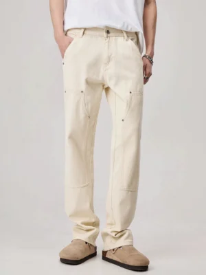 Men's apricot off-white rivet detail loose straight carpenter work pants front full body streetwear outfit