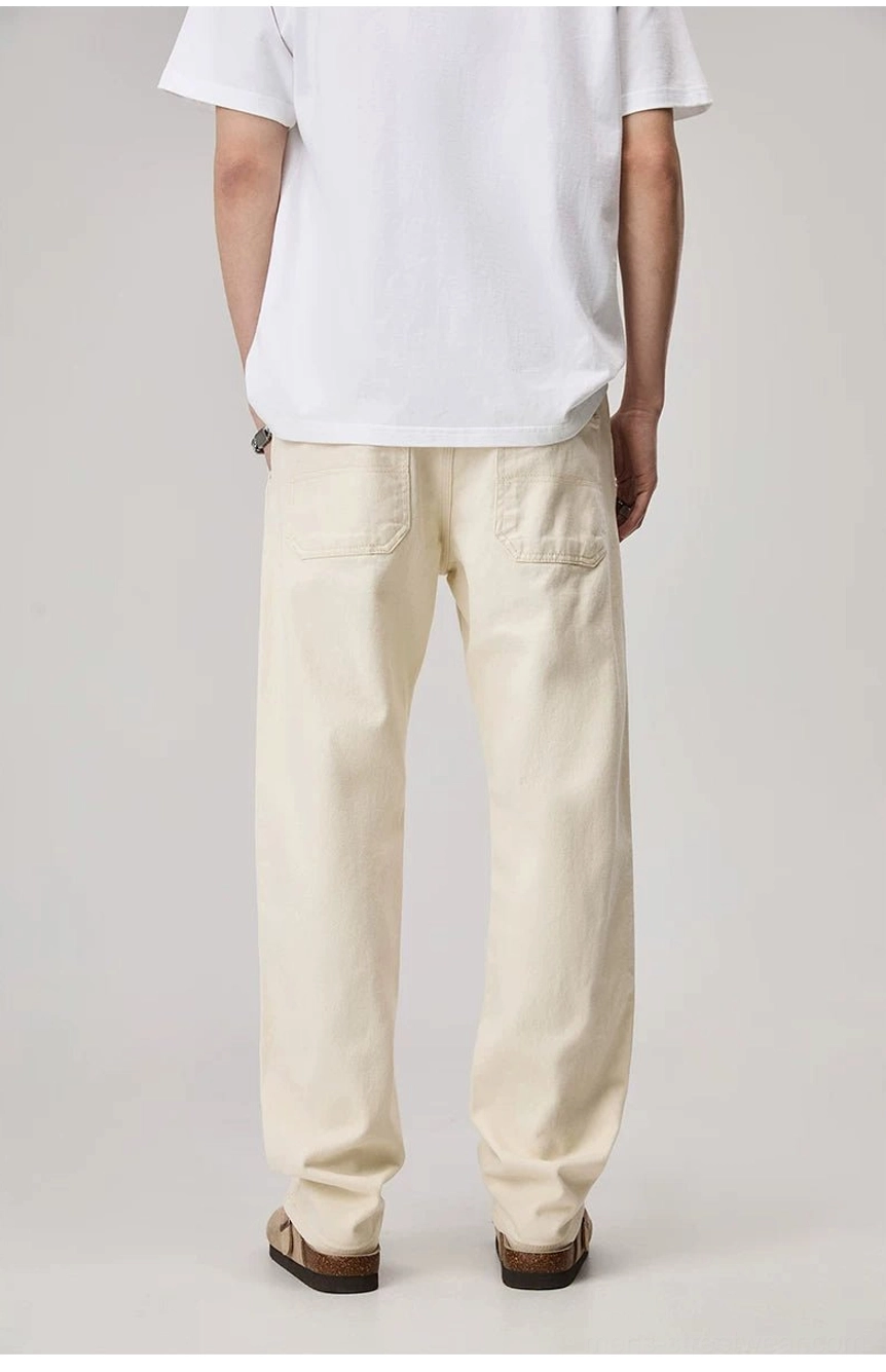 Men's apricot relaxed straight carpenter work pants rear view showing square back pockets and clean streetwear silhouette