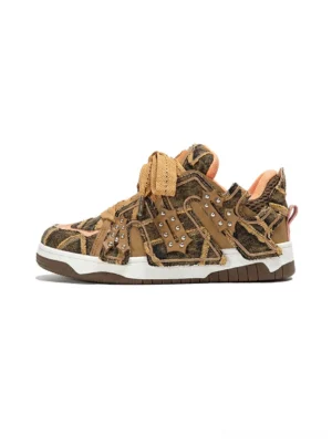 Brown camouflage rivet platform skate sneakers with distressed texture and thick white rubber outsole shown from the left side