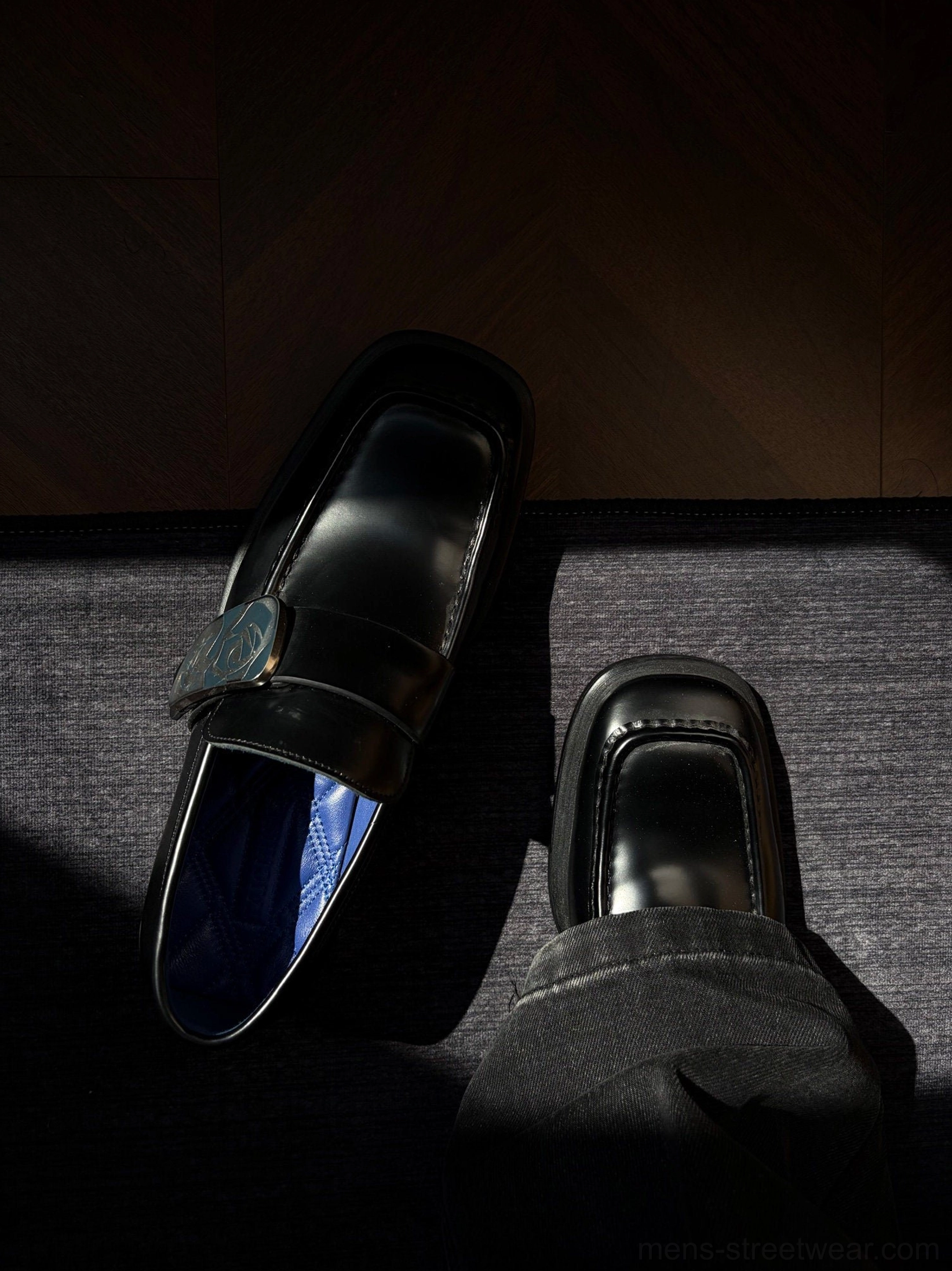 Rose crest black leather loafers shown worn with square toe design blue lining and polished streetwear finish