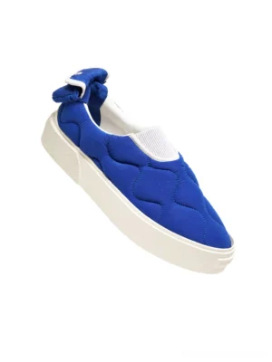 Royal blue quilted slip-on streetwear sneakers with elastic collar rear bow ornament and chunky white rubber sole