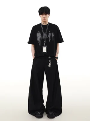 Black Runway Shadows oversized graphic T-shirt styled with wide-leg pants and lanyard for Korean streetwear fashion