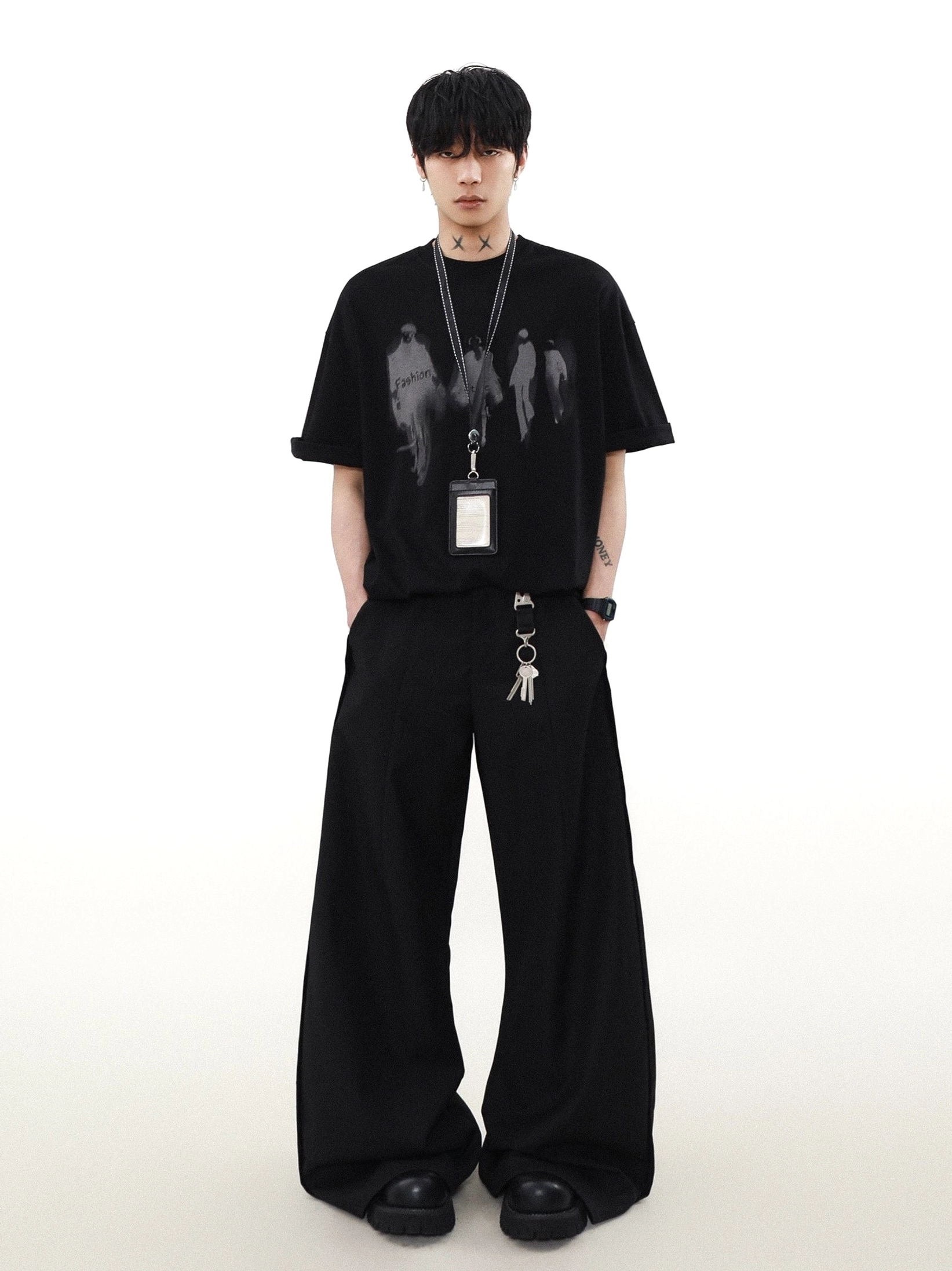 Black Runway Shadows oversized graphic T-shirt styled with wide-leg pants and lanyard for Korean streetwear fashion