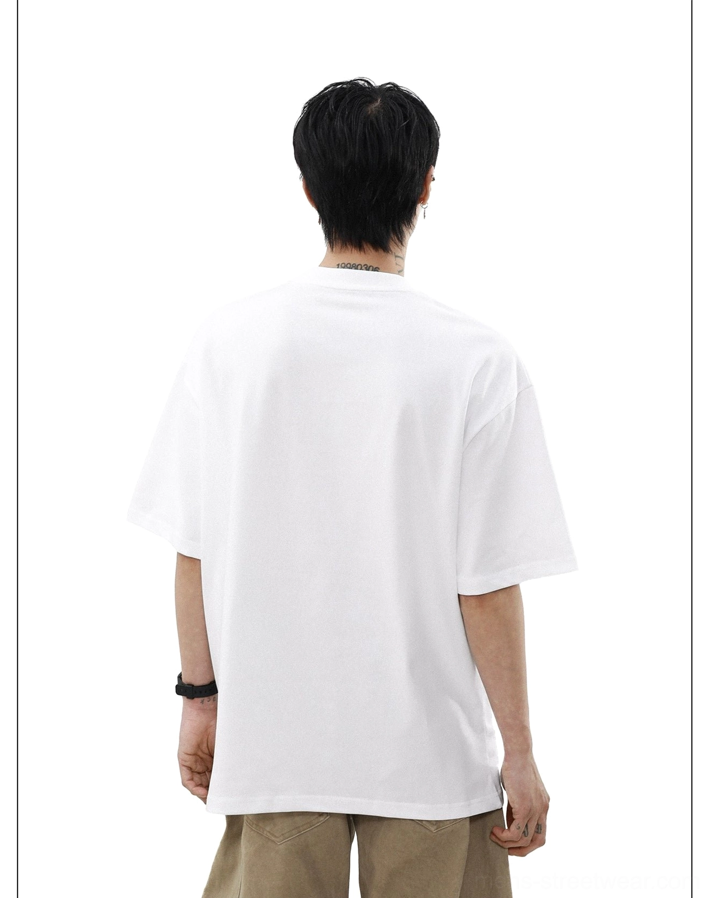 Back view of solid white oversized crewneck T-shirt with clean minimal fit and relaxed streetwear proportions