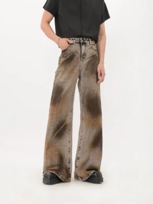 Black wide leg flare denim jeans with brown sunburst eclipse wash, high waist button closure and raw hem detail front view