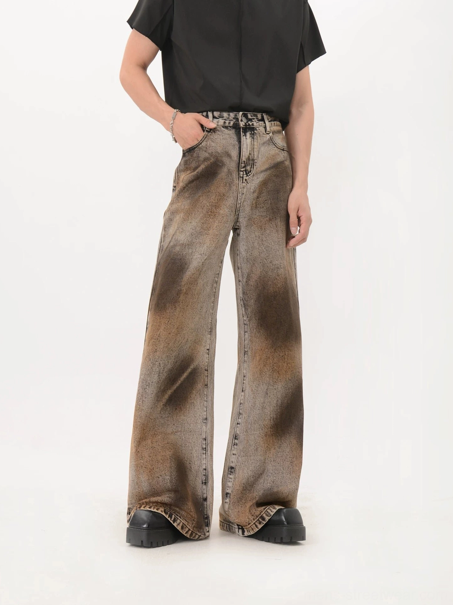 Black wide leg flare denim jeans with brown sunburst eclipse wash, high waist button closure and raw hem detail front view