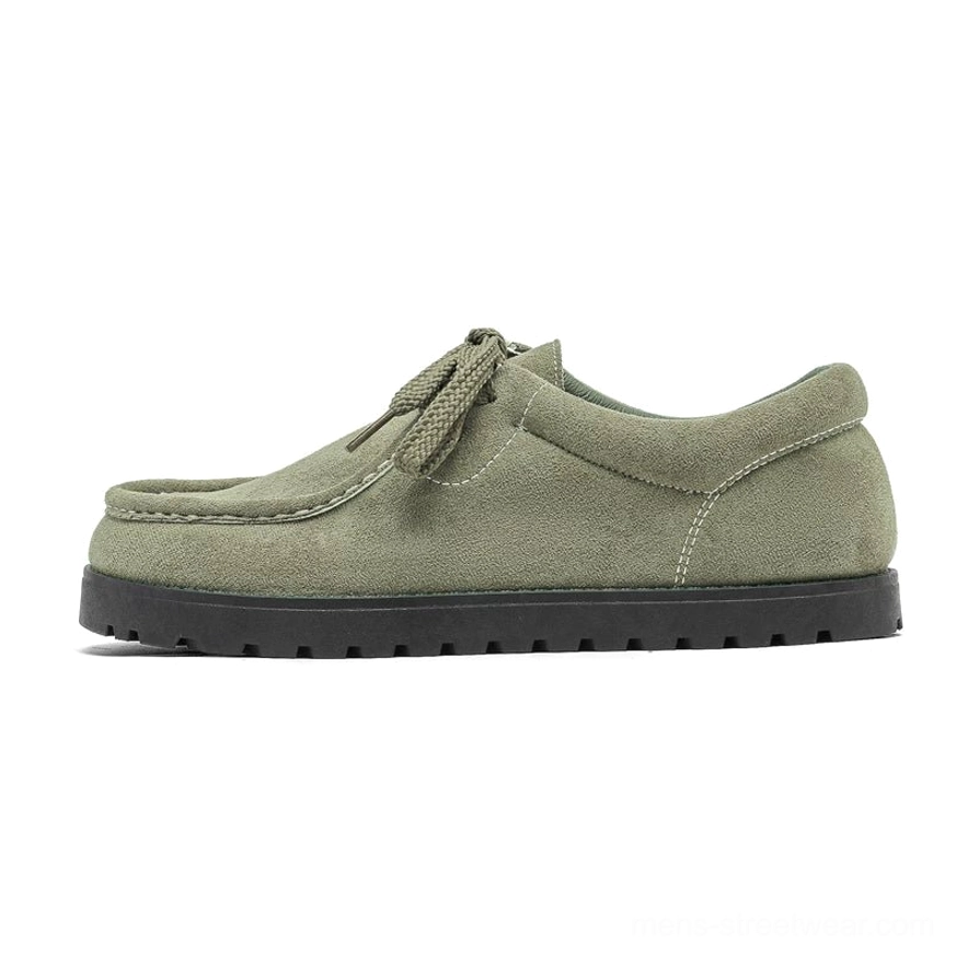 Sage green suede square-toe lace-up streetwear shoes with matching laces and thick black ridged sole in side profile