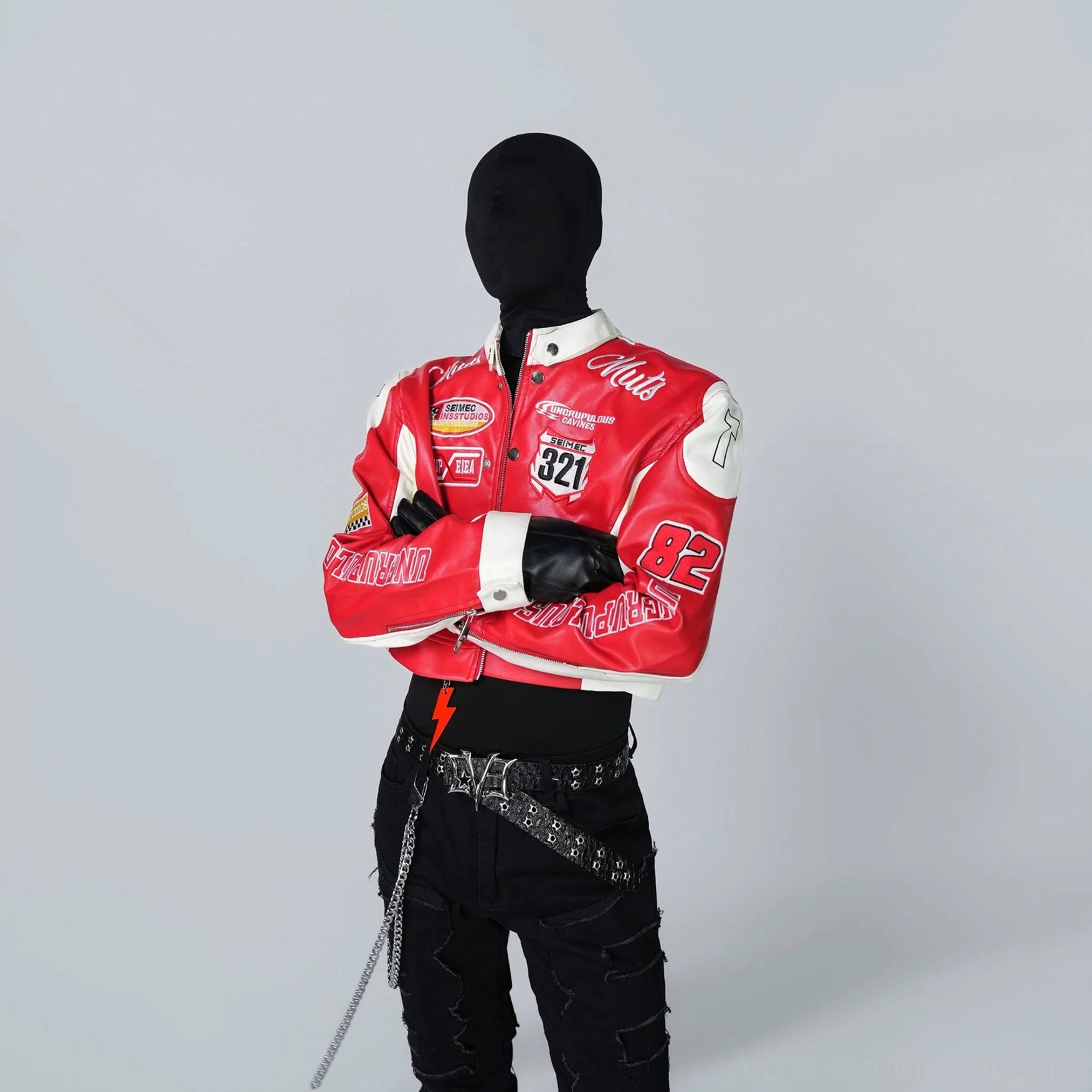Three-quarter front view of a scarlet red and white cropped racing jacket with 321 racing number patch, stand collar, textured PU leather, black fitted top, and chain accessories