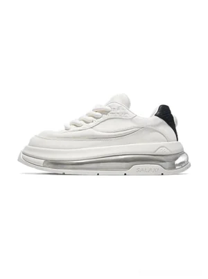 Cream and black sculpted leather air cushion streetwear sneaker shown in left lateral profile on a white studio background