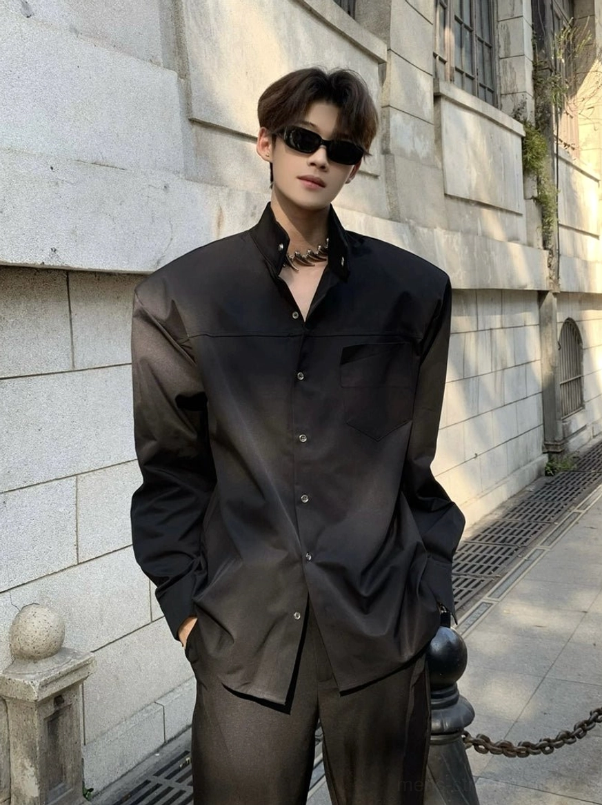 Black sculpted stand collar oversized streetwear shirt with button front and relaxed minimalist fit