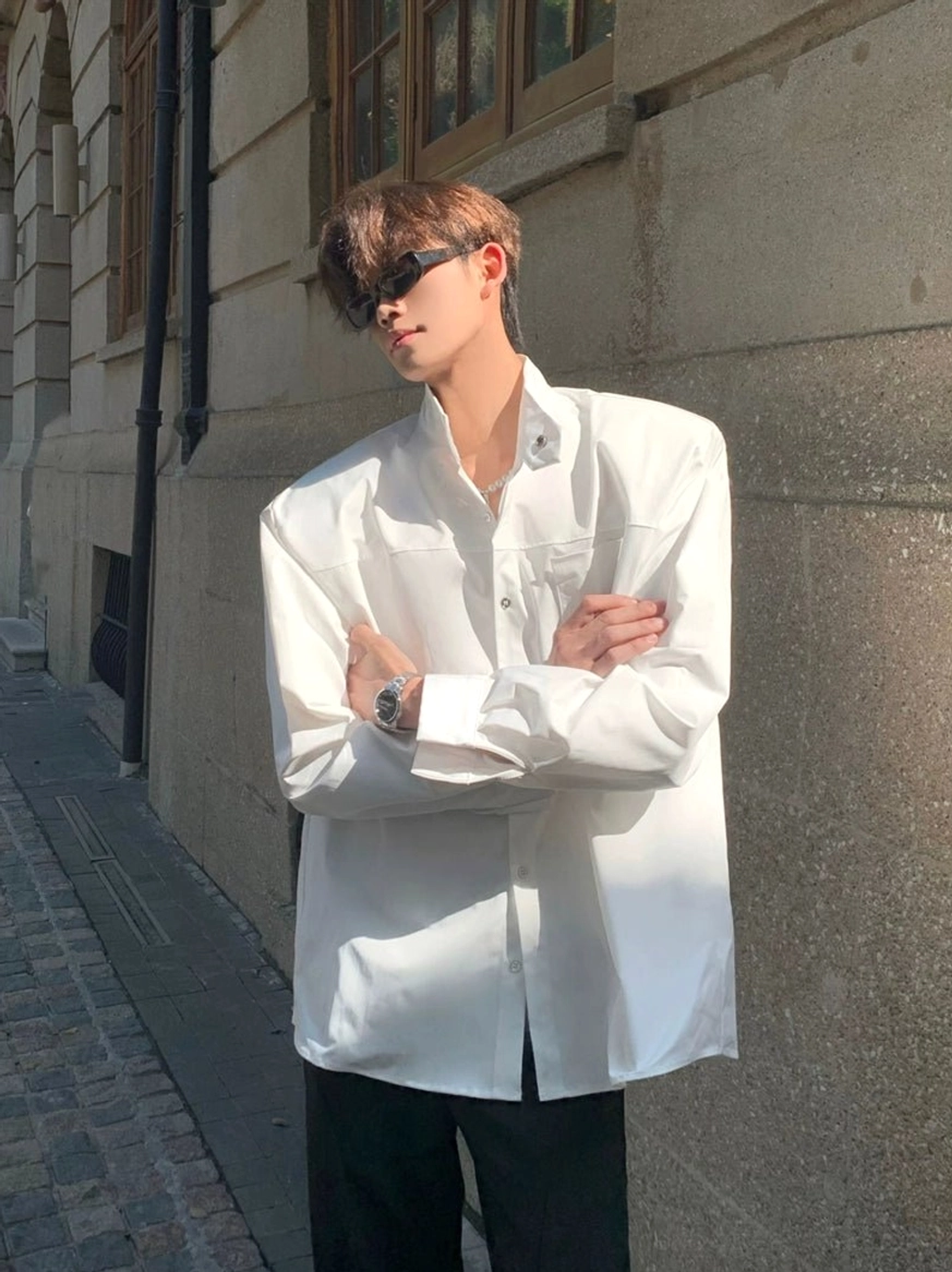 White oversized streetwear shirt with sculpted stand collar chest patch pocket and button front detail
