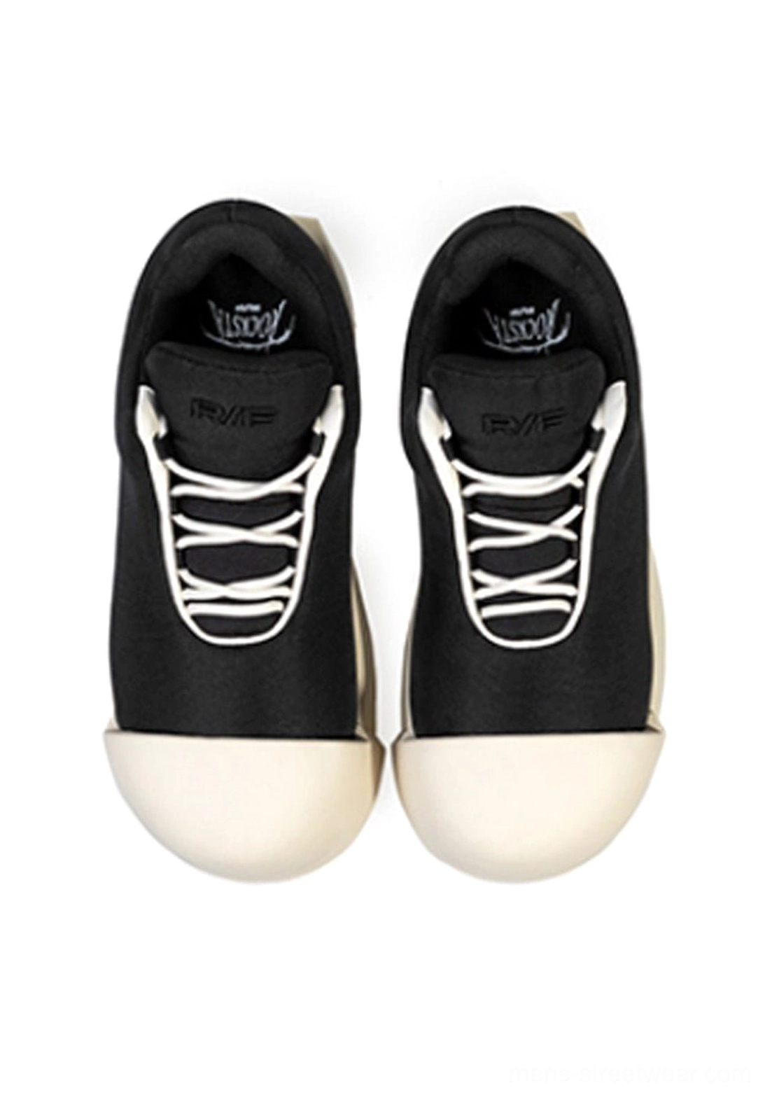 Sculpted-toe black platform low boots showcasing the lace-up front, padded collar, and bold two-tone design