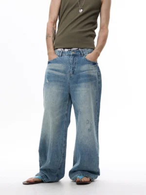 Seafoam fade arc balloon jeans in faded light blue denim shown in a front full-body streetwear outfit