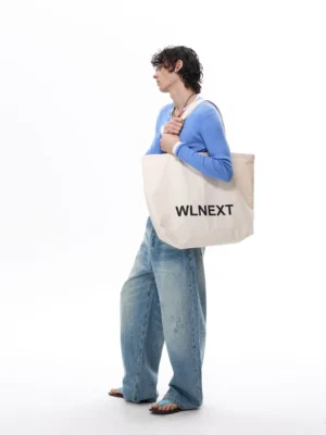 Side view of seafoam fade arc balloon jeans with oversized wide-leg vintage blue denim silhouette