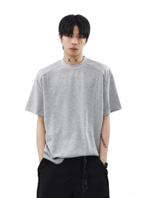 Heather gray relaxed fit seam detail T-shirt with structured shoulder seams styled with black wide leg trousers