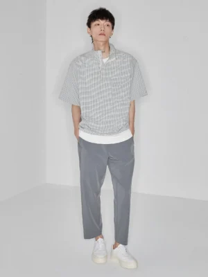 Light grey side-seam-free elastic waist cropped pants shown with a half-zip top and white sneakers