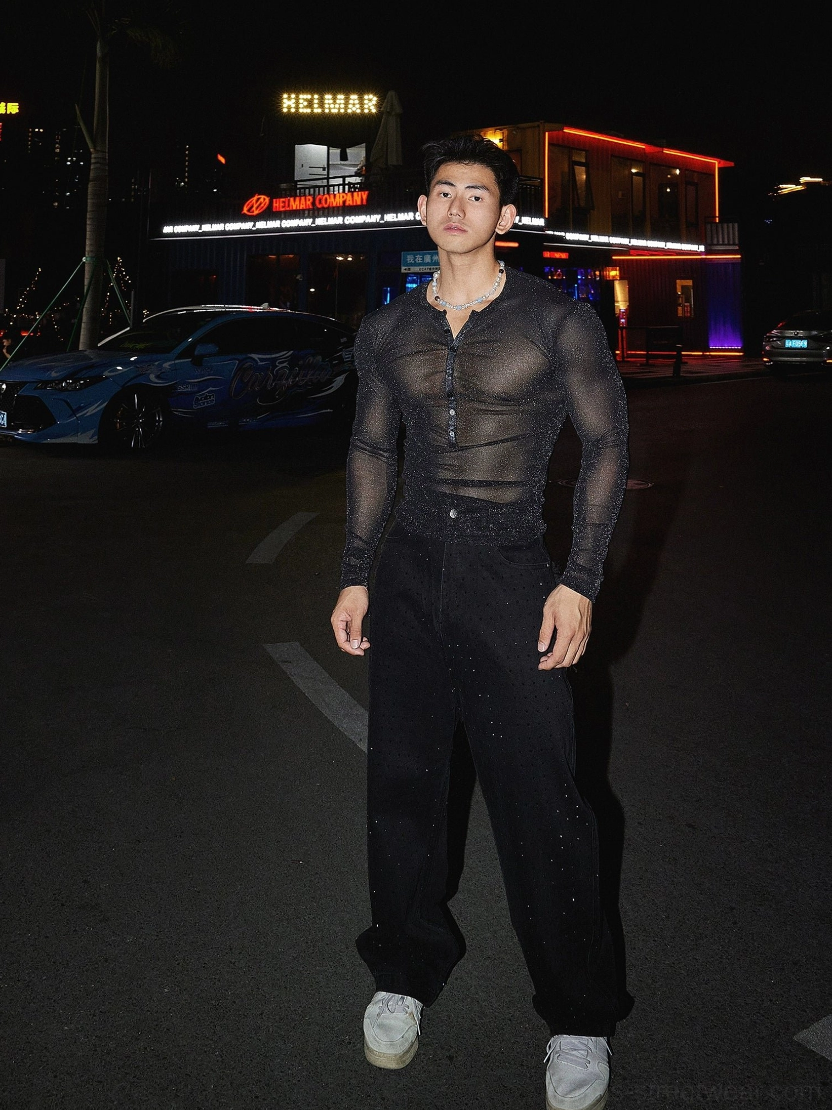 Modern sheer sparkly Henley mesh top with button neckline for Seoul-inspired men's fashion styling