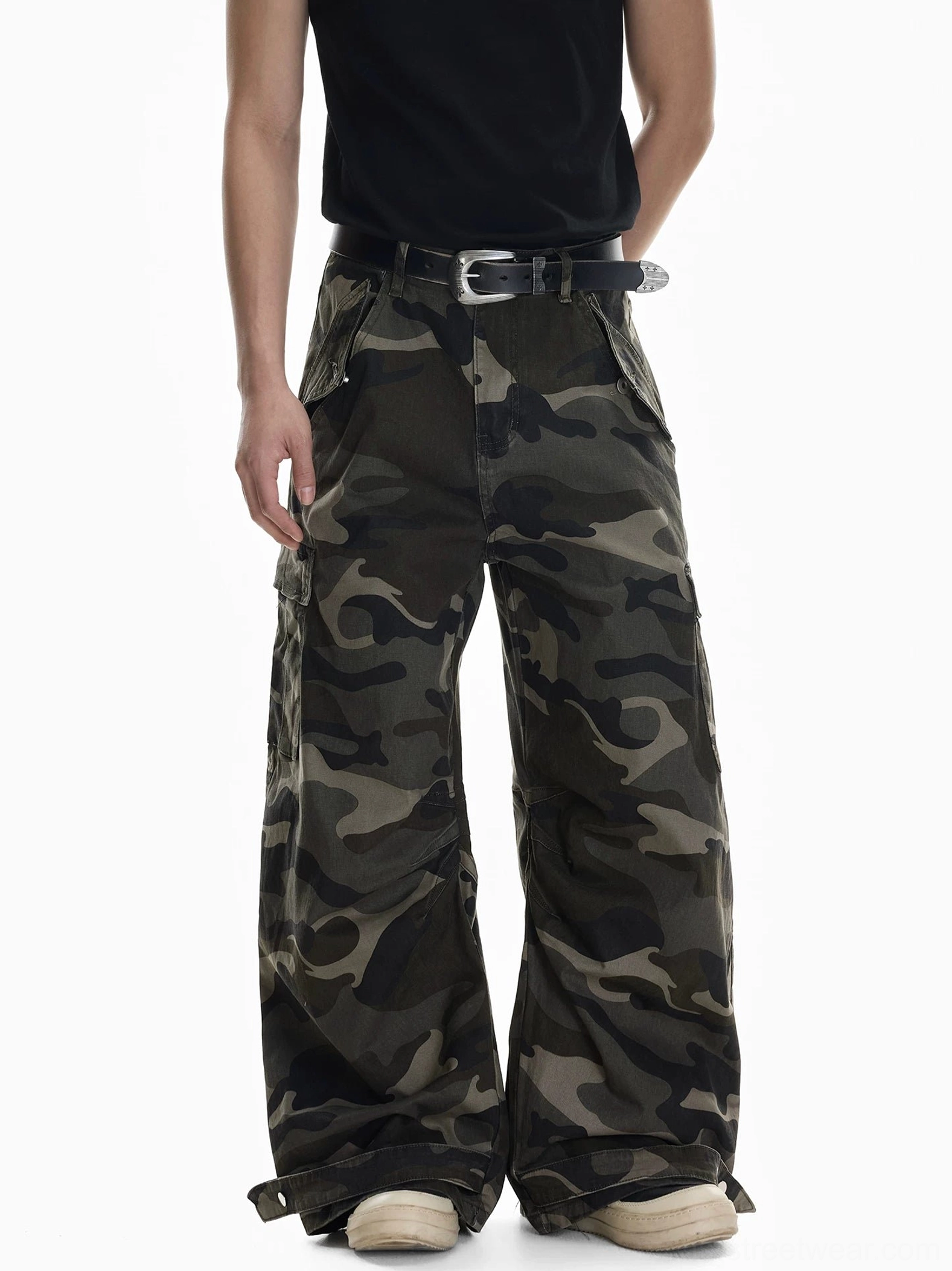 Shadow Ops woodland camo wide leg cargo pants front full body view with oversized streetwear fit and adjustable ankle tabs