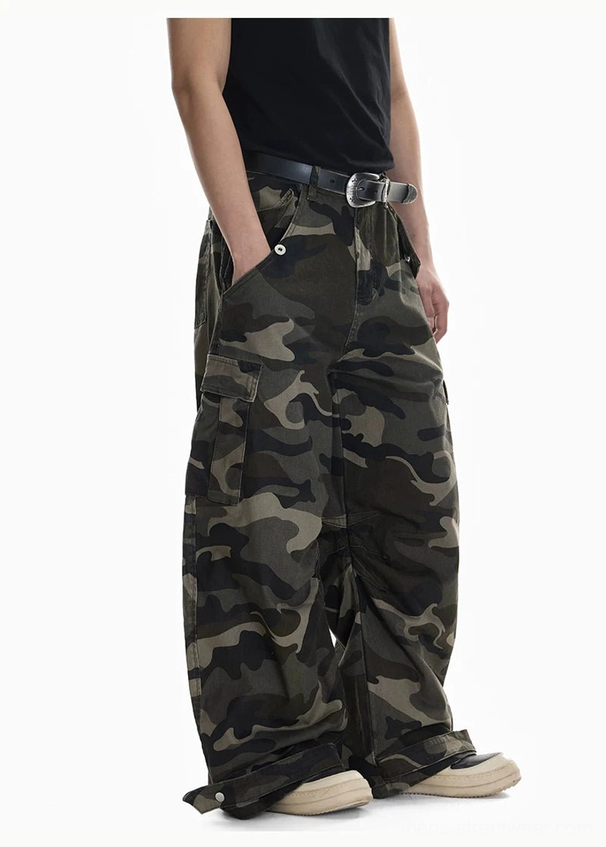 Shadow Ops woodland camo baggy cargo pants side three quarter view showing wide leg drape and cargo pocket detail