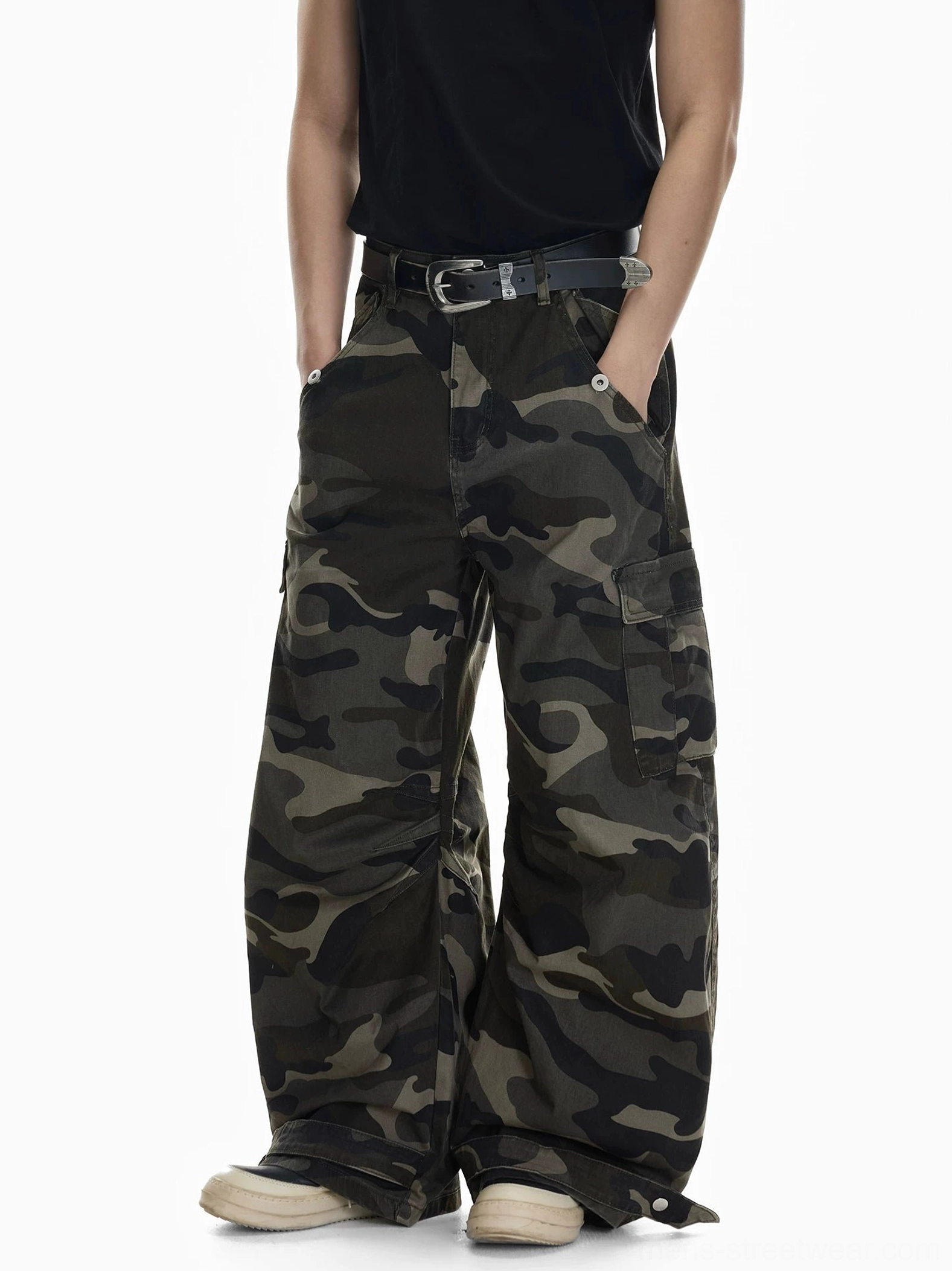 Shadow Ops woodland camo cargo pants side front view showing utility side pockets and adjustable button ankle cuffs