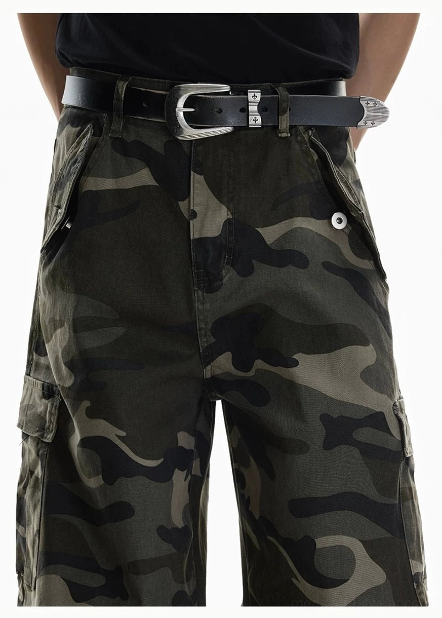 Close up of Shadow Ops woodland camo cargo pants waist with belt loops zip fly and button flap utility pocket