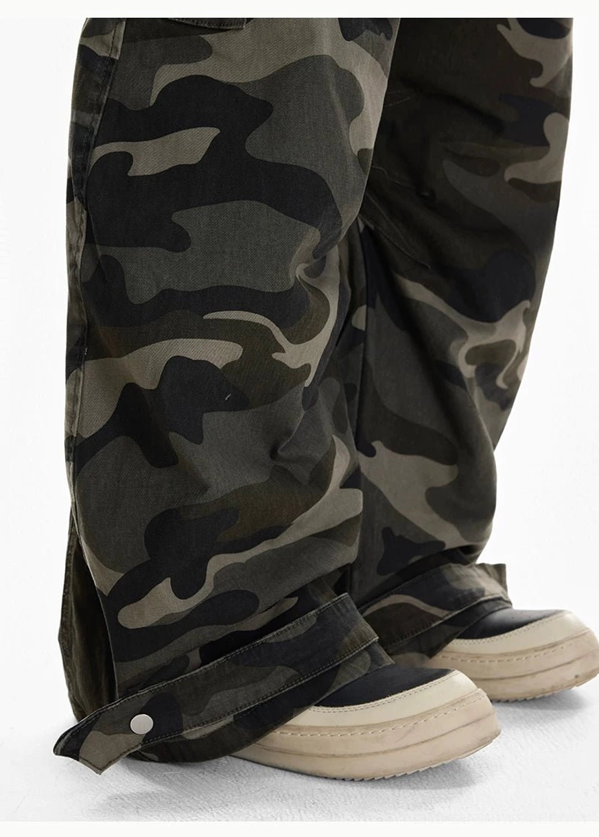 Shadow Ops woodland camo wide leg cargo pants lower leg close up showing loose stacked hem and adjustable ankle tab