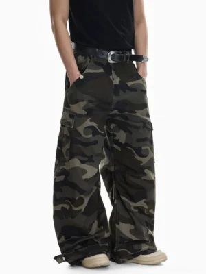 Shadow Ops woodland camouflage wide leg cargo pants three quarter front view showing relaxed baggy streetwear silhouette
