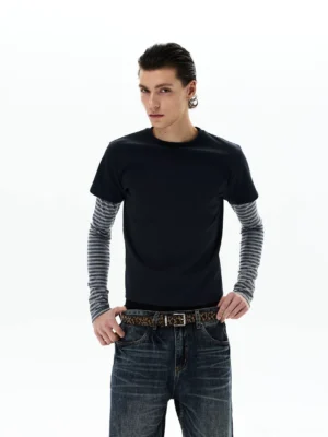 Front full-body view of a shadow stripe layered long sleeve tee styled with wide-leg jeans and a leopard print belt in minimalist studio lighting