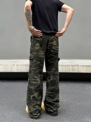 Rear full-body view of dark woodland camouflage wide-leg cargo pants showing back pockets and relaxed streetwear fit