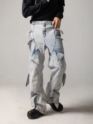 Front view of acid wash light blue shark fin panel baggy jeans with wide legs and layered denim pocket details