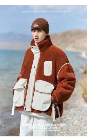 Three-quarter view of a relaxed sherpa cargo jacket with a stand collar, oversized fit, and outdoor streetwear styling