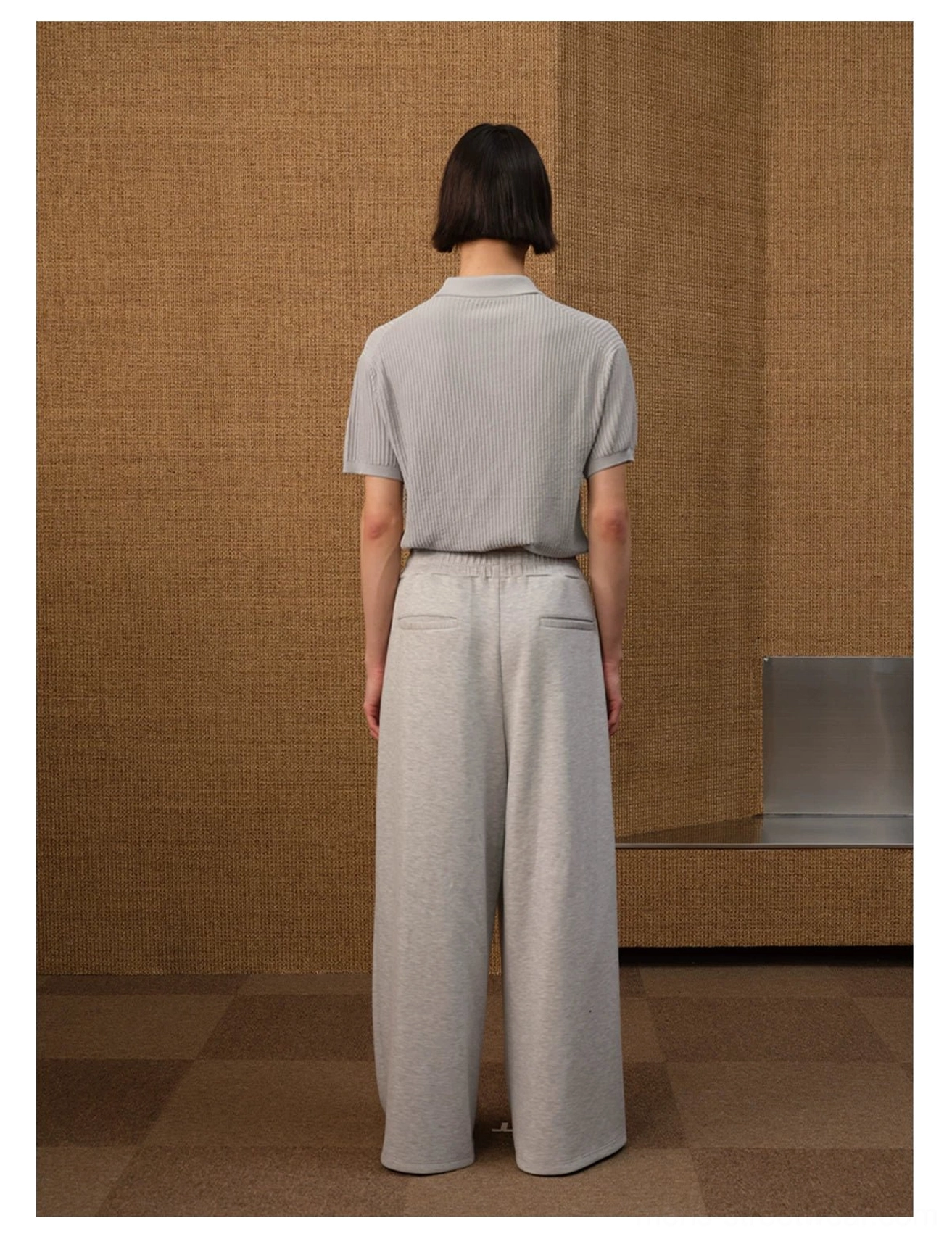 Short-sleeve textured knit polo shirt with open V-collar, ribbed cuffs, and contemporary minimalist styling