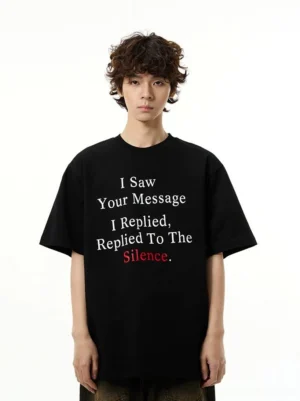 Front view of oversized Silence Message graphic T-shirt styled with dark pants in Korean streetwear fashion