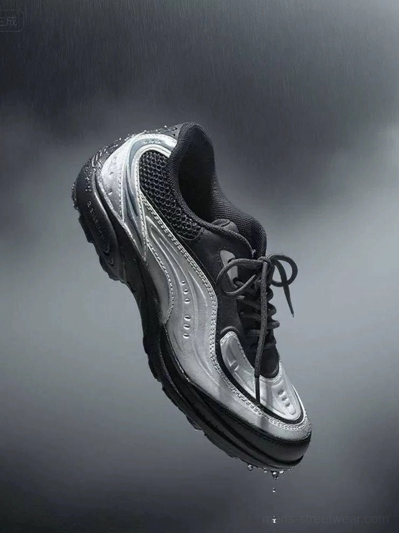 Silver black wave runner sneakers with metallic overlays, breathable mesh panels, chunky techwear sole, and water droplets in a dark studio setting