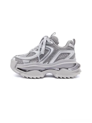 Silver gray mesh runner sneakers with layered curved overlays, chunky sculpted sole, and futuristic streetwear design shown in a front three-quarter product view