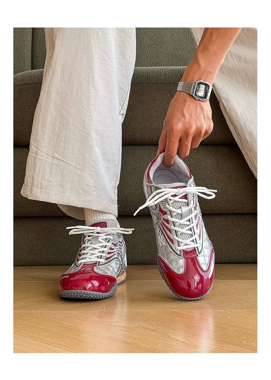 Three-quarter on-foot view of silver heart mesh retro sneakers with loose off-white trousers, hand-adjusted lace closure, padded collar, and casual Korean streetwear styling indoors