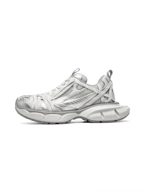 Silver layered mesh chunky runner sneaker in left lateral view with metallic overlays and sculpted grey sole