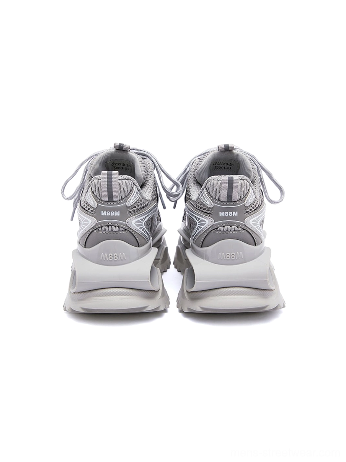 Rear view of silver mesh runner sneakers showing the heel tabs, unified gray outsole, and clean low-top chunky sneaker construction