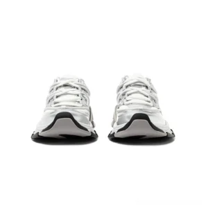 Front view of silver panel chunky sneakers with black rubber toe cap, layered mesh upper, and flat lace-up closure