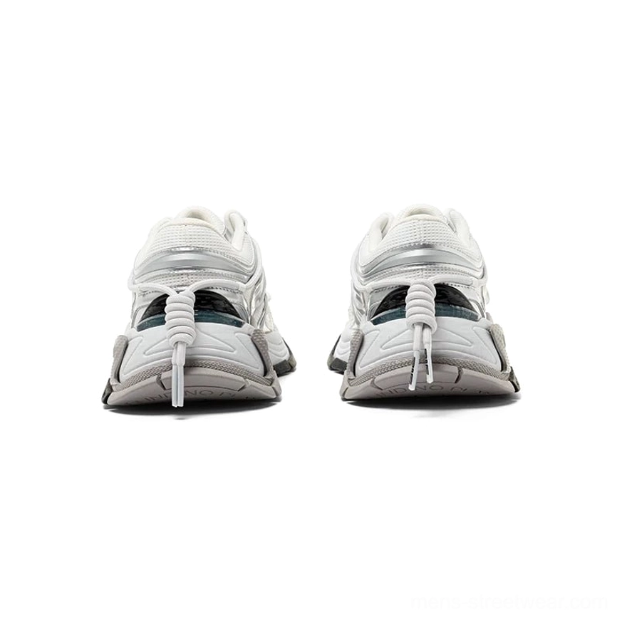 Rear view of silver white chunky runner sneakers showing metallic heel overlays, bungee-style pull cords, and grey midsole accents