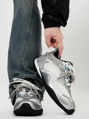 Silver white retro mesh runner sneakers with layered synthetic panels and blue washed jeans streetwear styling